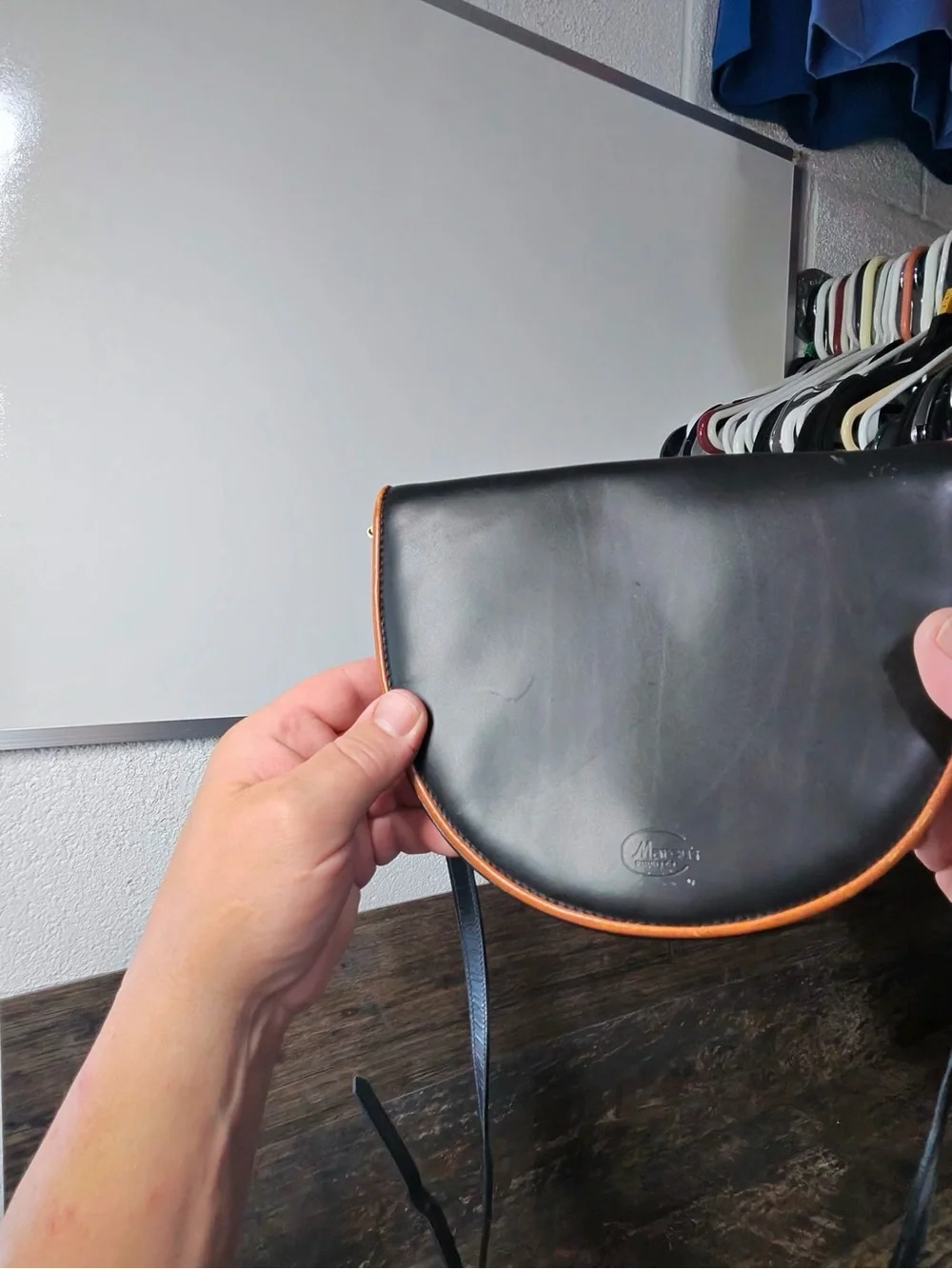 Leather Crescent Crossbody Bag in Black with Brown Trim